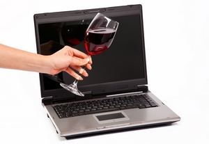 laptop and glass of red wine laptop and glass of red wine